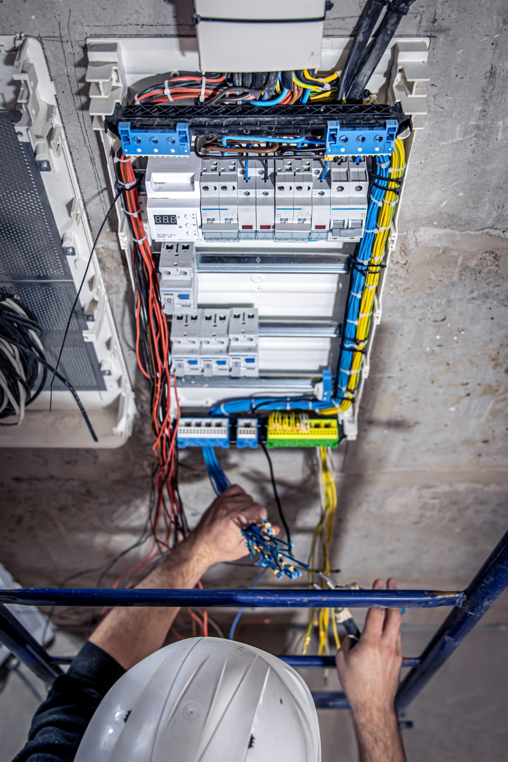 a person working on a wiring board