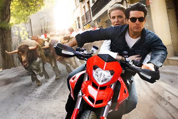 a man and woman riding a motorcycle