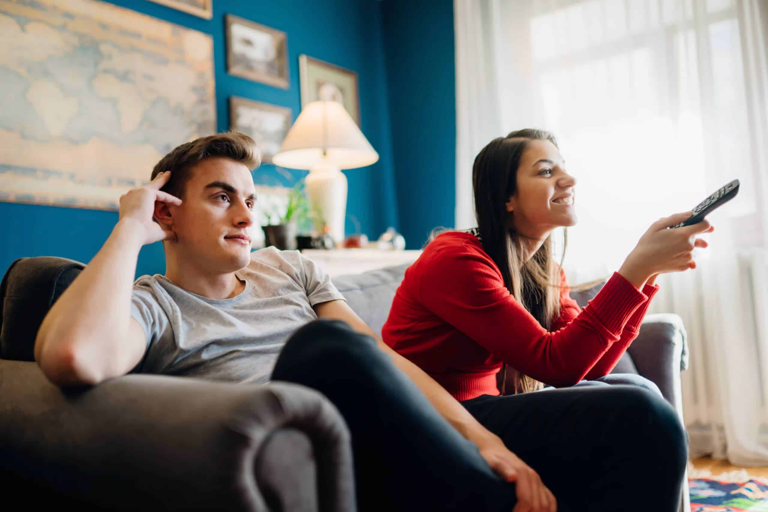 a man and woman sitting on a couch