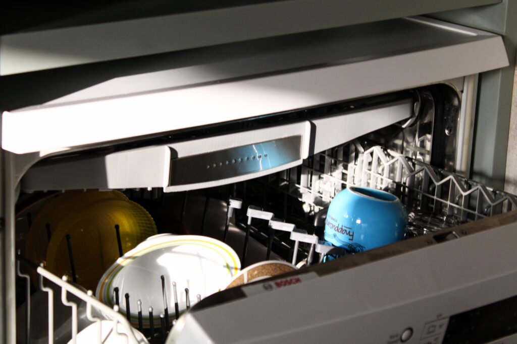 a dishwasher with dishes in it